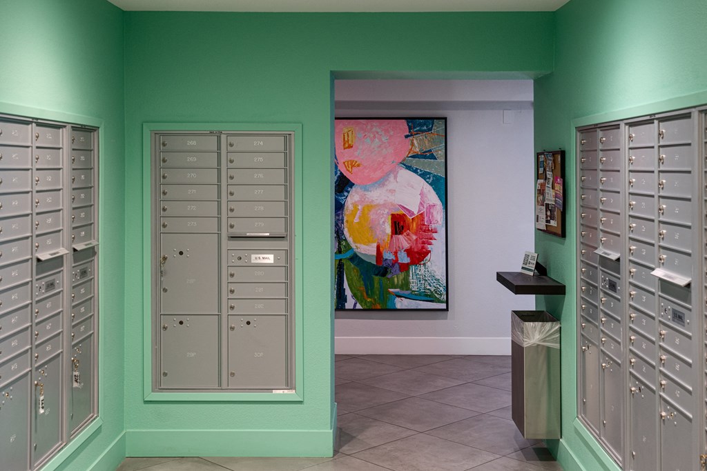 a locker room with lockers and a painting on the wall