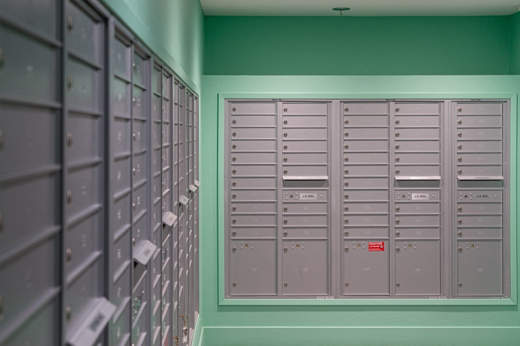 a row of lockers in a room with green walls