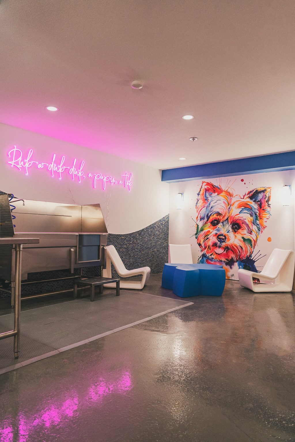 a painting of a dog on a wall in a hospital lobby