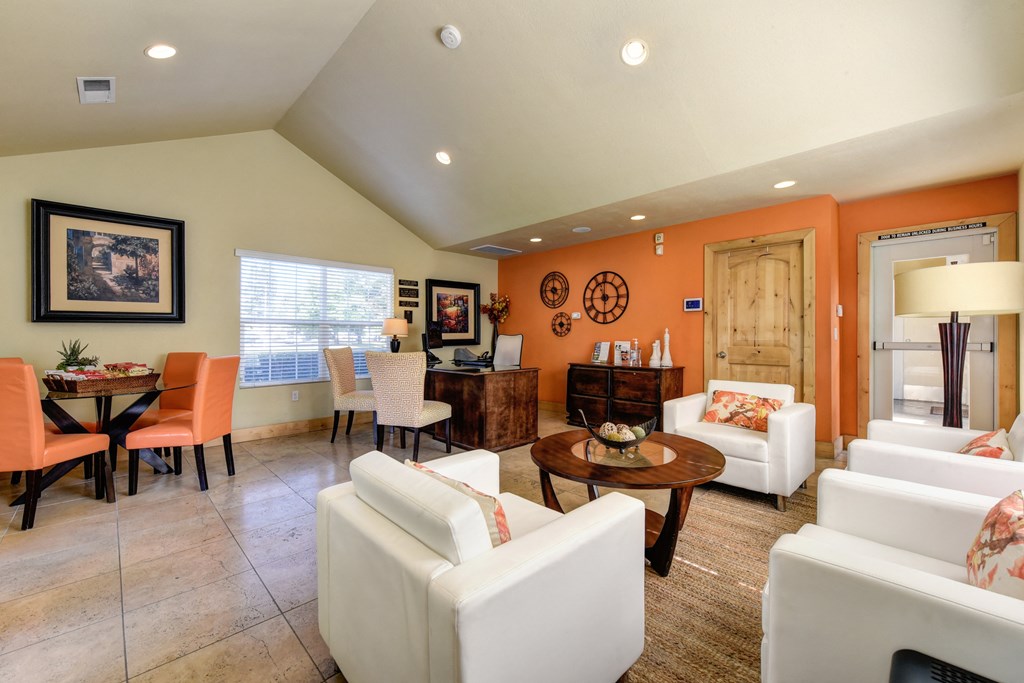 Vineyard terrace leasing office with lounge area and orange accent wall at Vineyard Terrace Apartments, Napa