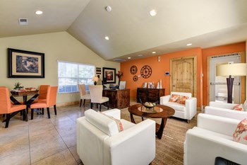 Vineyard terrace leasing office with lounge area and orange accent wall.  - Photo Gallery 34