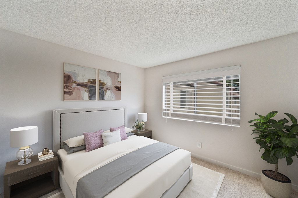 a bedroom with a large bed and a window