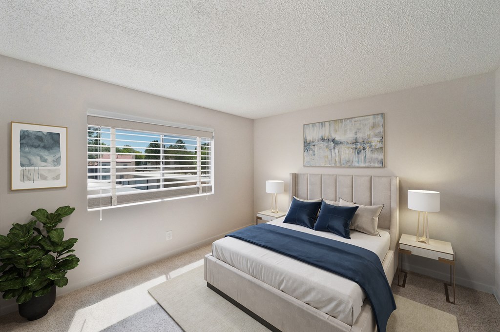 West Oaks Primary bedroom with bed, two nightstands, and window