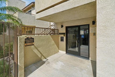 The entrance to a building with a Leasing Office sign.