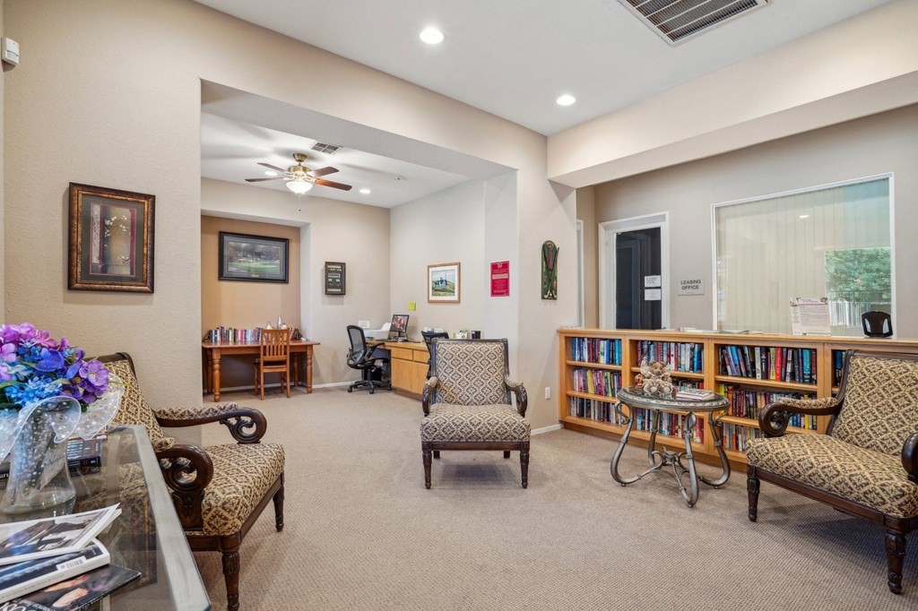 a living room filled with furniture and a library