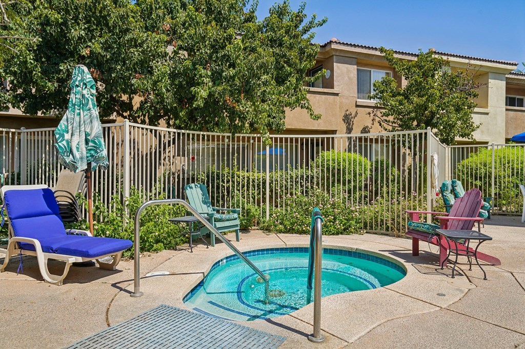 our apartments have a private hot tub and a patio with chairs