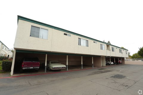 A parking garage with a red line painted on the ground.