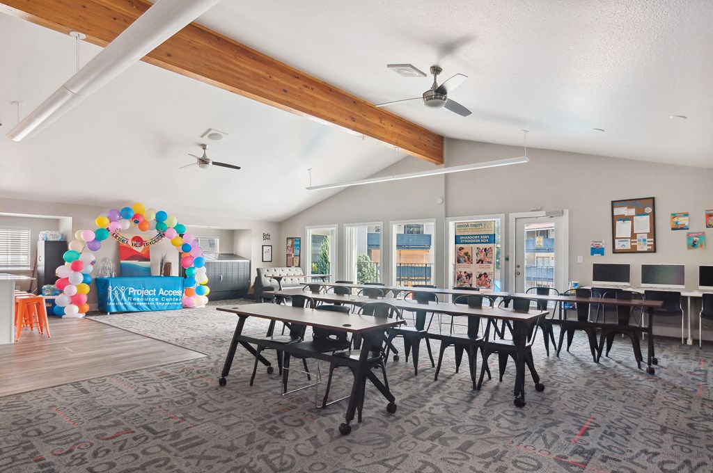 a large dining room with tables and chairs and a balloon decoration
