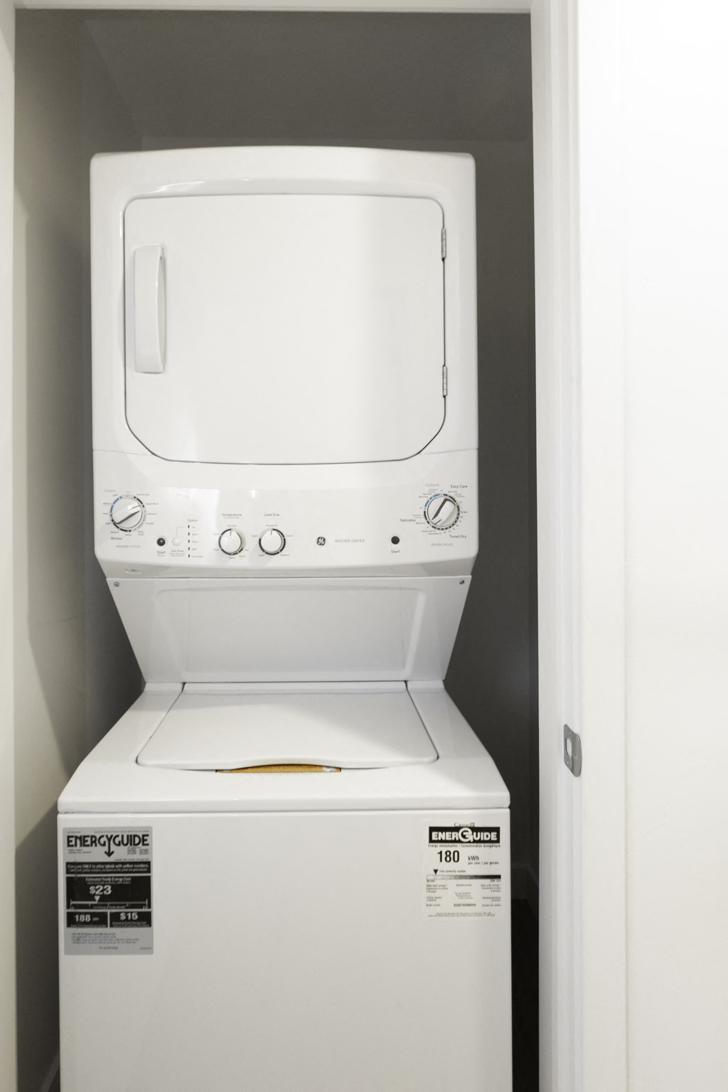 a white washer and dryer in a closet