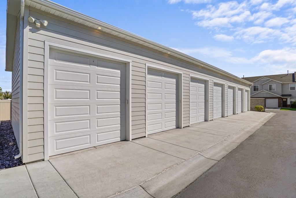 a row of garage doors on the side of a building