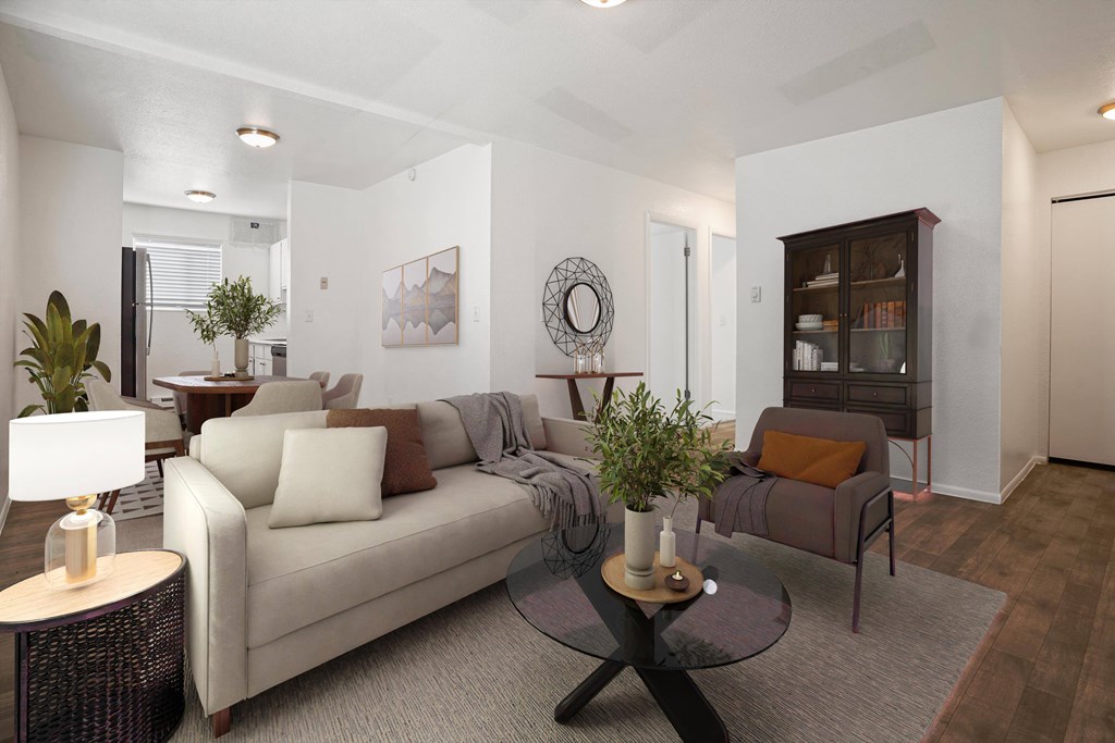 A living room with a couch, a coffee table, and a lamp.