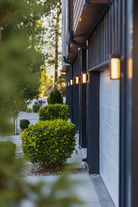 A row of lights are lined up on the side of a building.