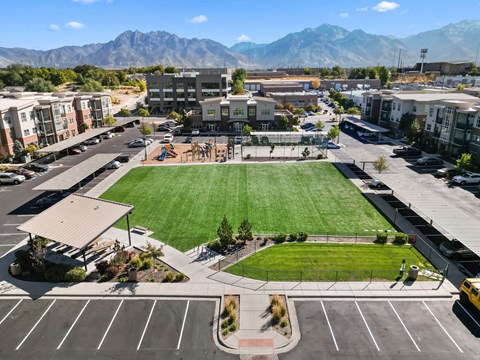 an aerial view of a field in the middle of a parking lot