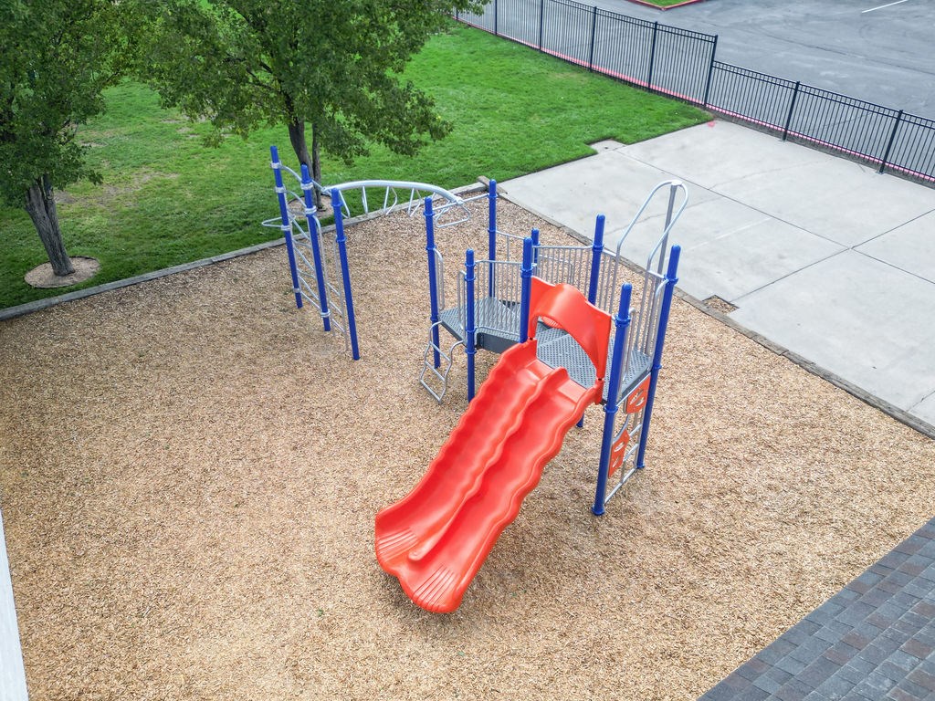 a slide on a playground in a park