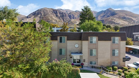 A building with a mountain in the background.