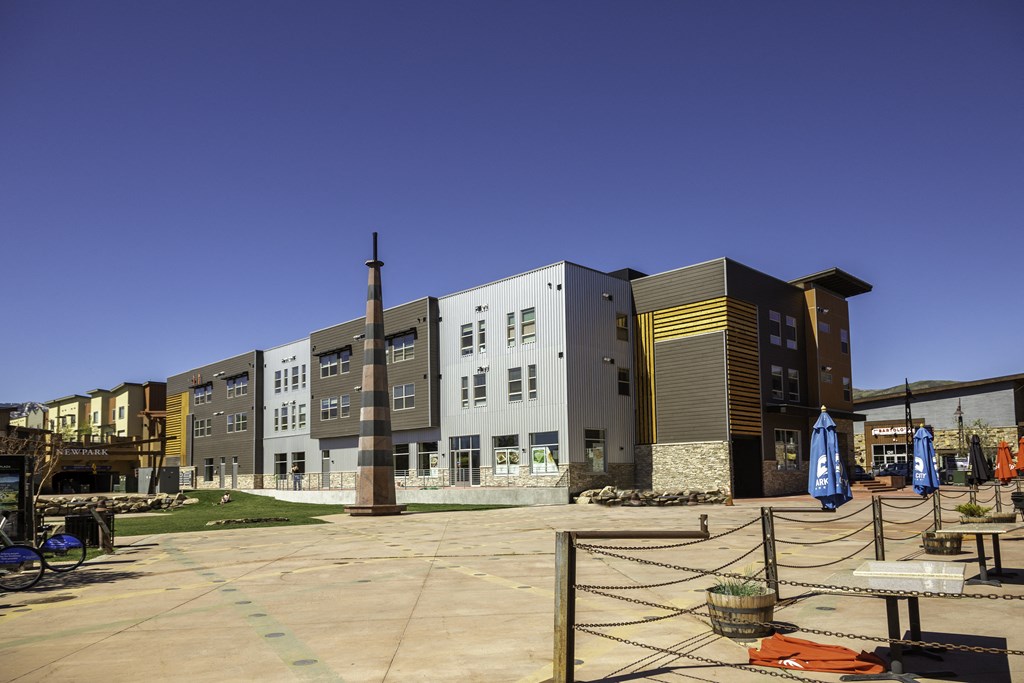 a group of new apartment buildings at a development in a city