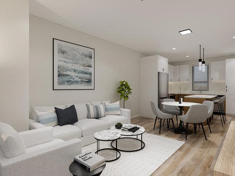 a living room with a couch a table and a chair