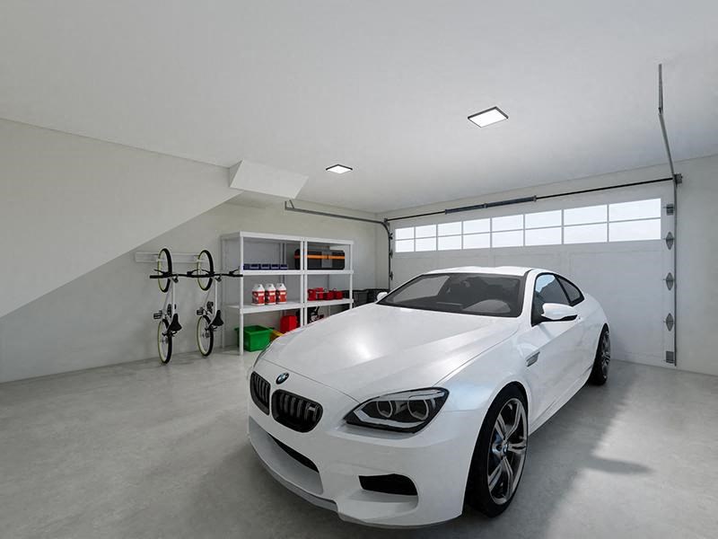 a white car parked in a garage next to a bike