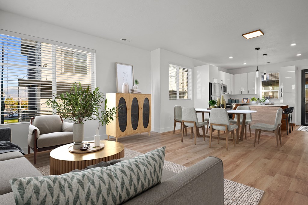 a living room with a couch and a table with chairs