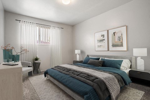 a bedroom with a bed and two pictures on the wall