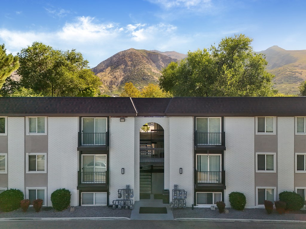 A building with a mountain in the background.