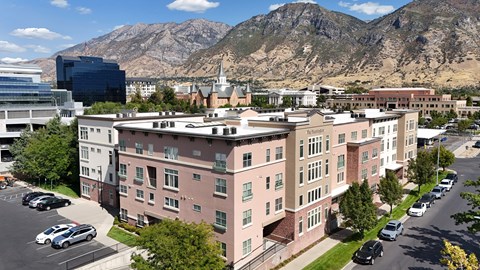 A large building with a parking lot in front of it.