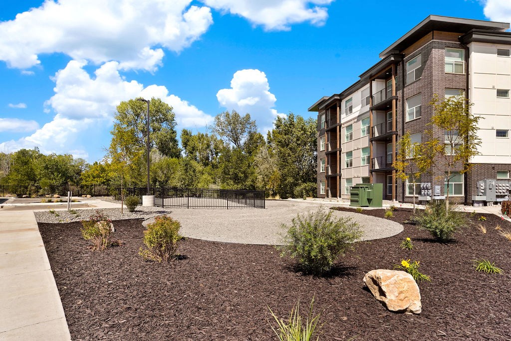 an empty courtyard with a building in the background