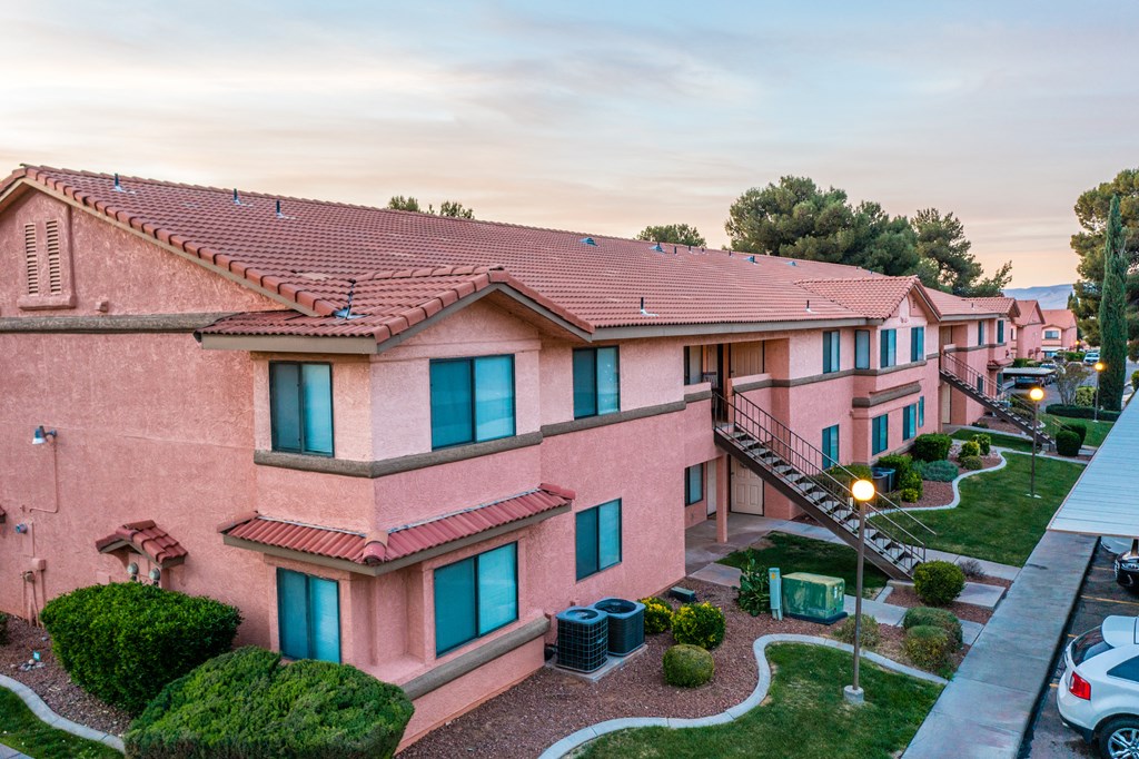 a building with a red brick exterior and a stairway