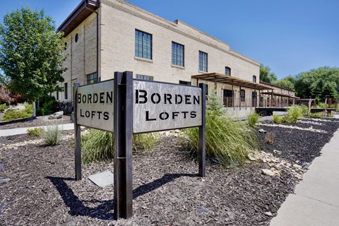 A sign that says Borden Lofts in front of a building.