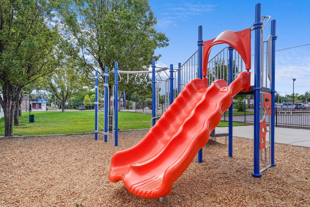 a slide on a playground at a park