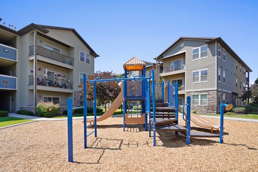 a playground at the whispering winds apartments in pearland, tx