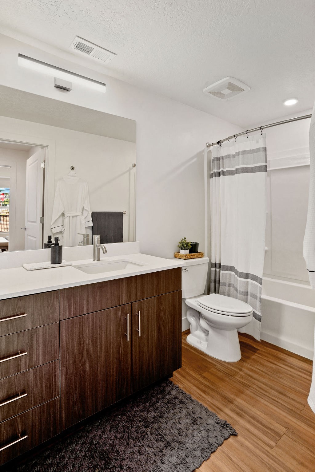 a bathroom with a toilet sink and bathtub