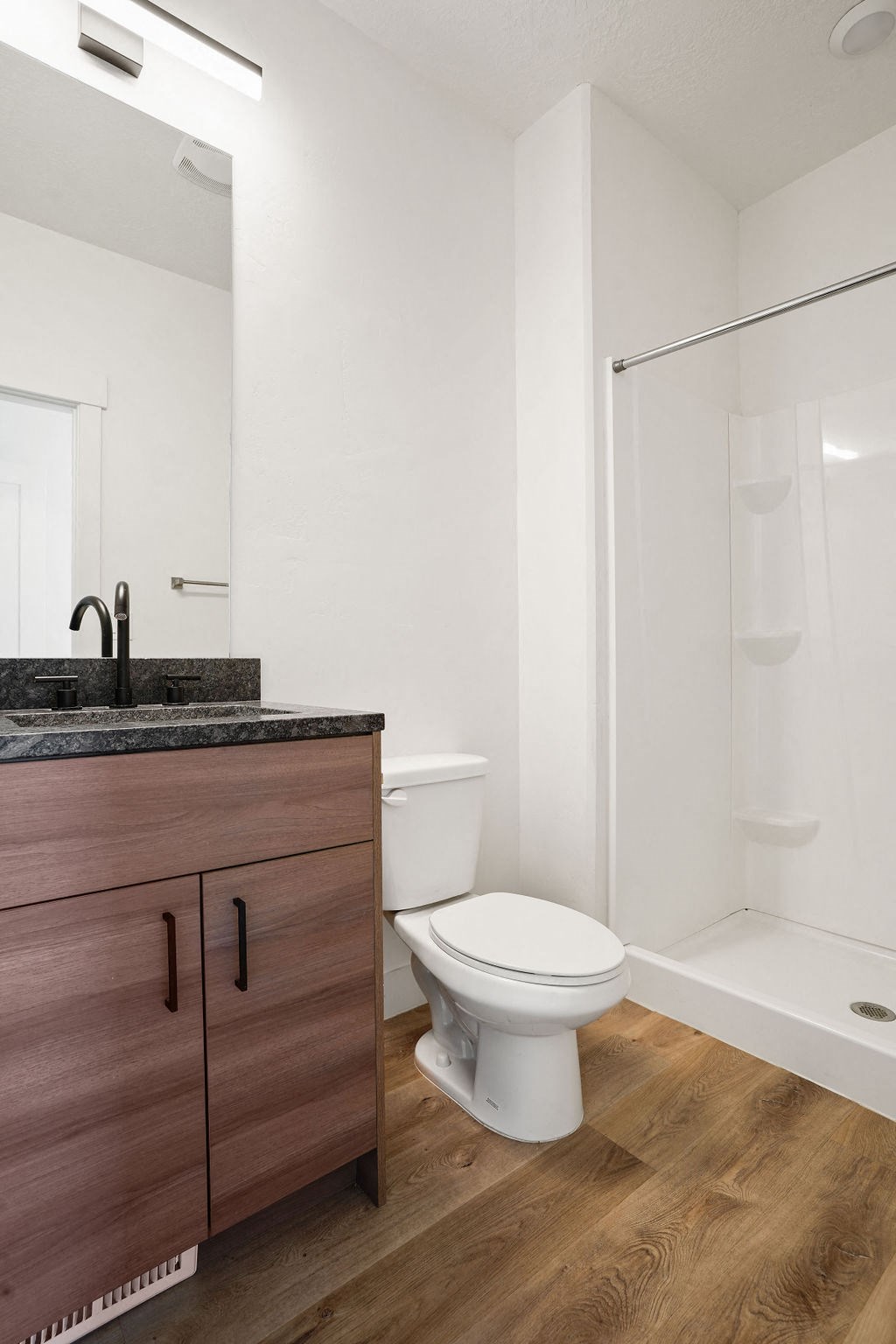 a bathroom with a toilet and a sink