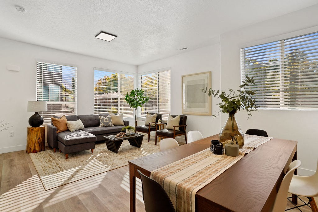 a living room and dining room at Greens by Lotus Townhomes, Ogden, UT