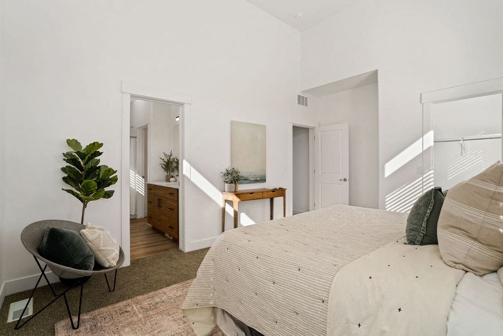 a bedroom with a bed and a dresser