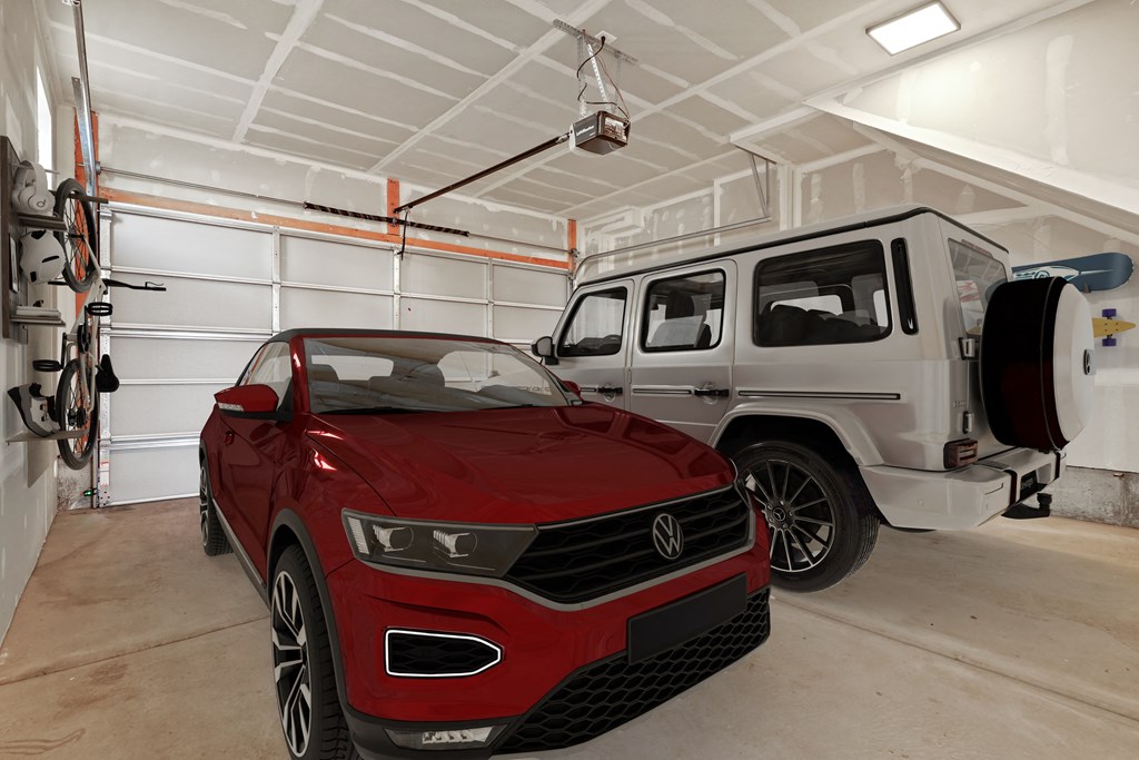 a red car and a white jeep in a garage