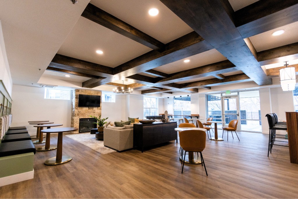 A modern living room with wooden floors and furniture.