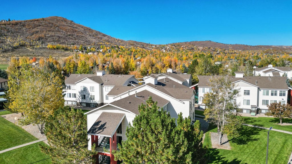 aerial view of neighborhood with mountains in the background