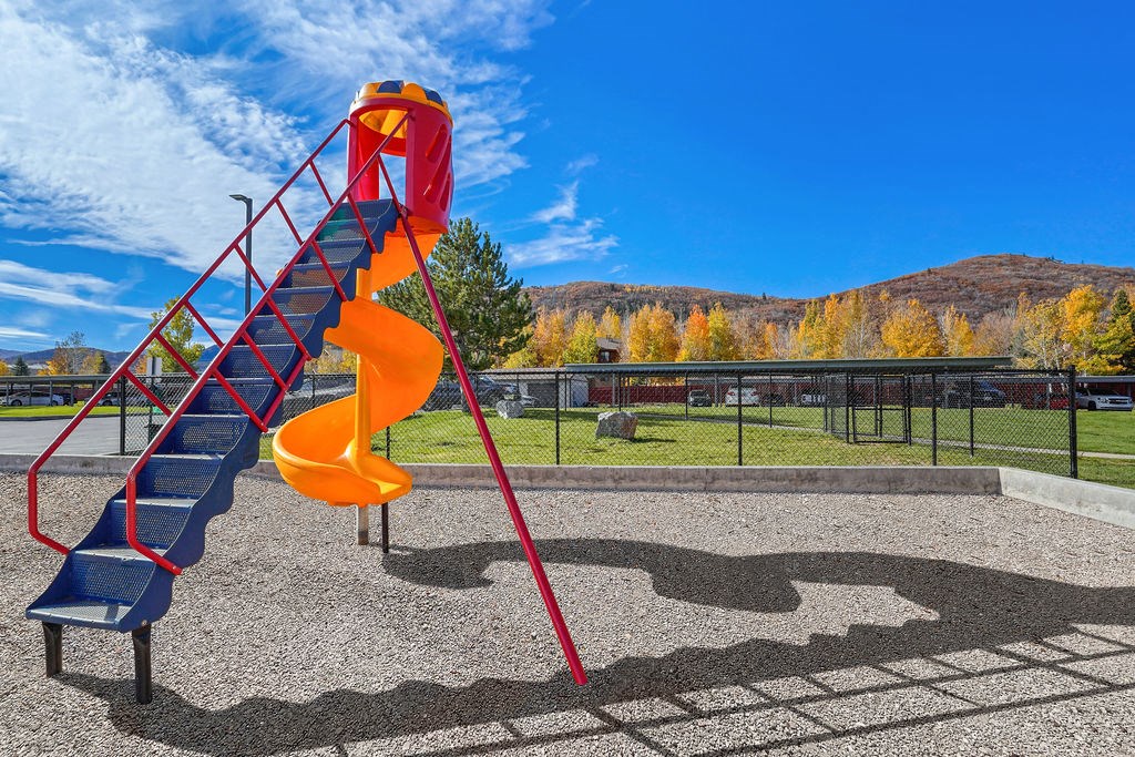 a slide on a playground in a park