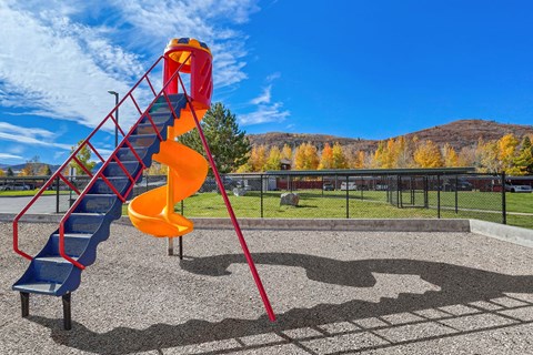 a slide on a playground in a park