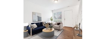 a living room with a blue couch and a coffee table