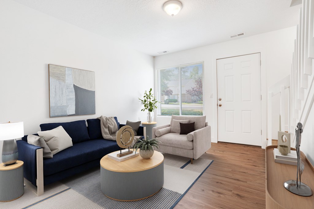 a living room with a blue couch and a coffee table
