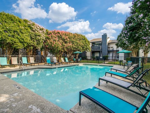 Resort-style swimming pool at The Melville Apartments in Lake Highlands, Dallas, TX