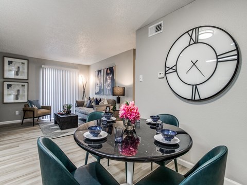 Dining area in a modern apartment home at The Melville Apartmentsor four.