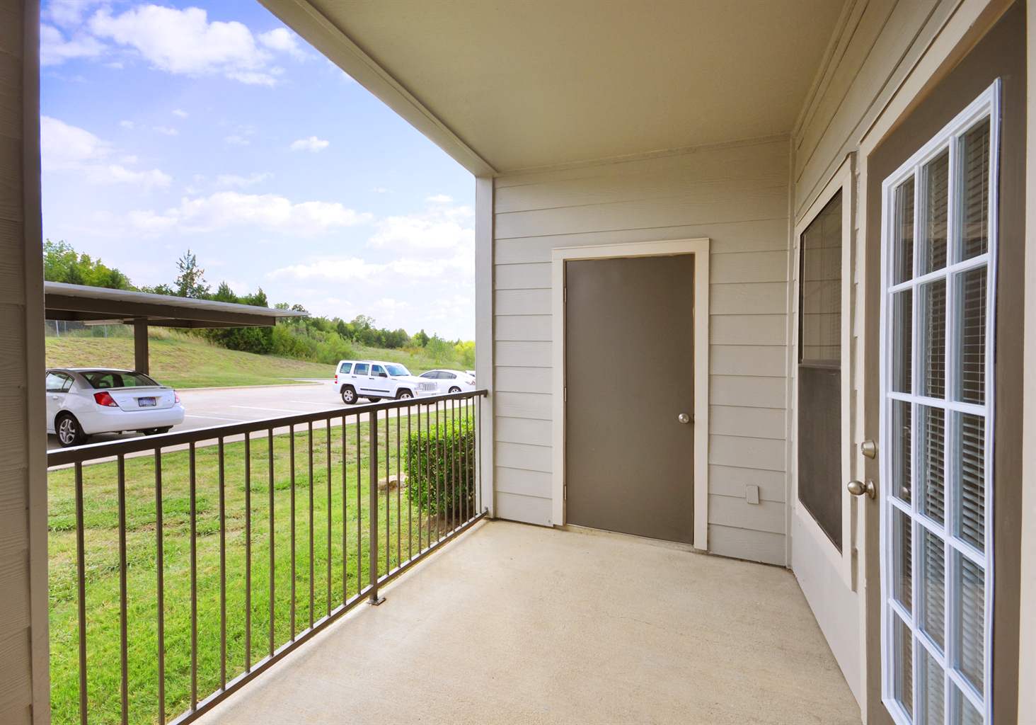 Covered Patio with Storage Facility at Stoneleigh on Cartwright Apartments, J Street Property Services, Mesquite,Texas