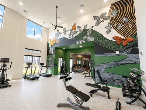Modern fitness center with cardio and strength equipment at The Bluewood