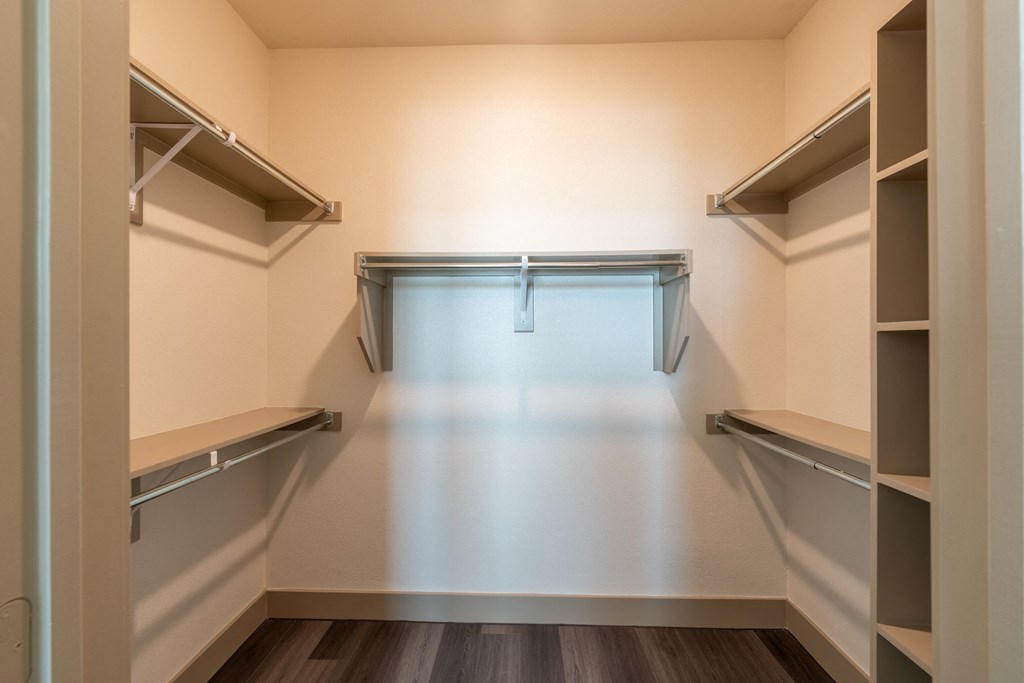 a walk in closet at the oxford at estonia apartments in san antonio, at One Preston Station, Texas