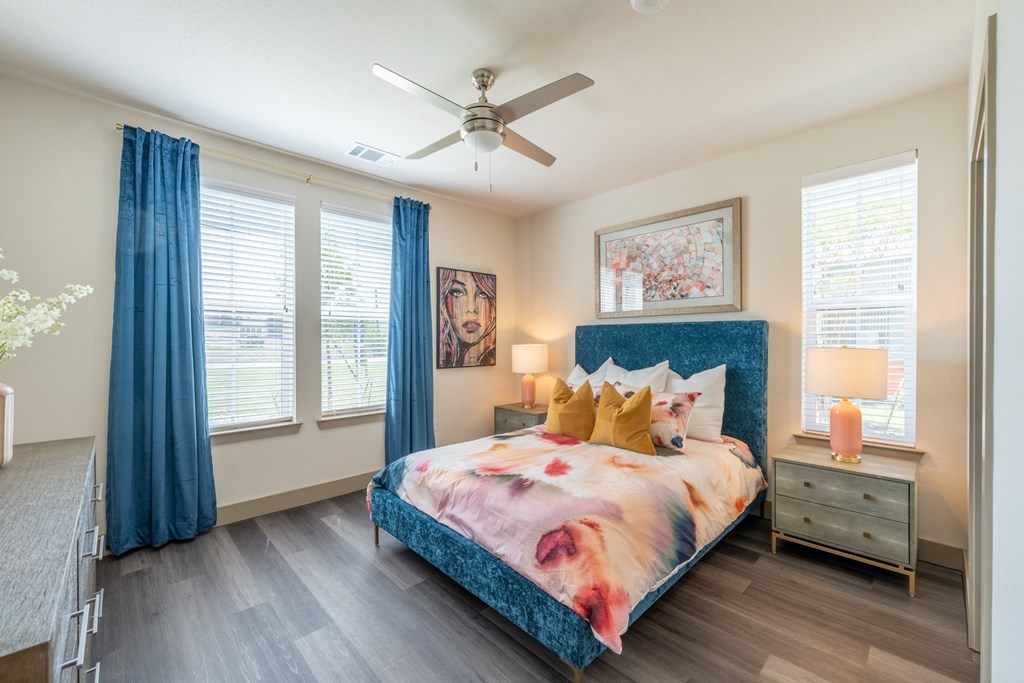 a bedroom with a bed and a ceiling fan at One Preston Station, Celina, TX, 75009
