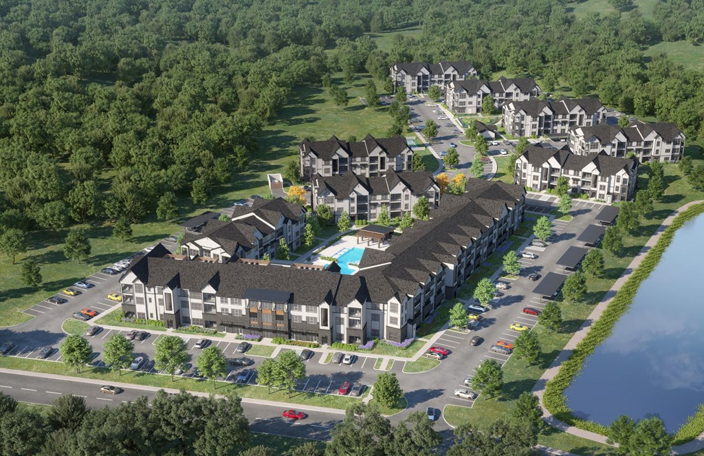A bird's eye view of a residential complex with a swimming pool.