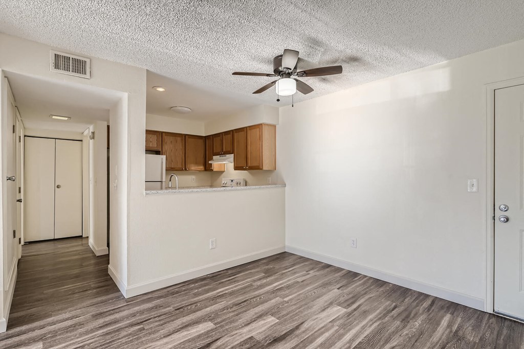 Our Non-Renovated Apartment Kitchens and Hallway at Horizon East Apartments in Aurora, Colorado